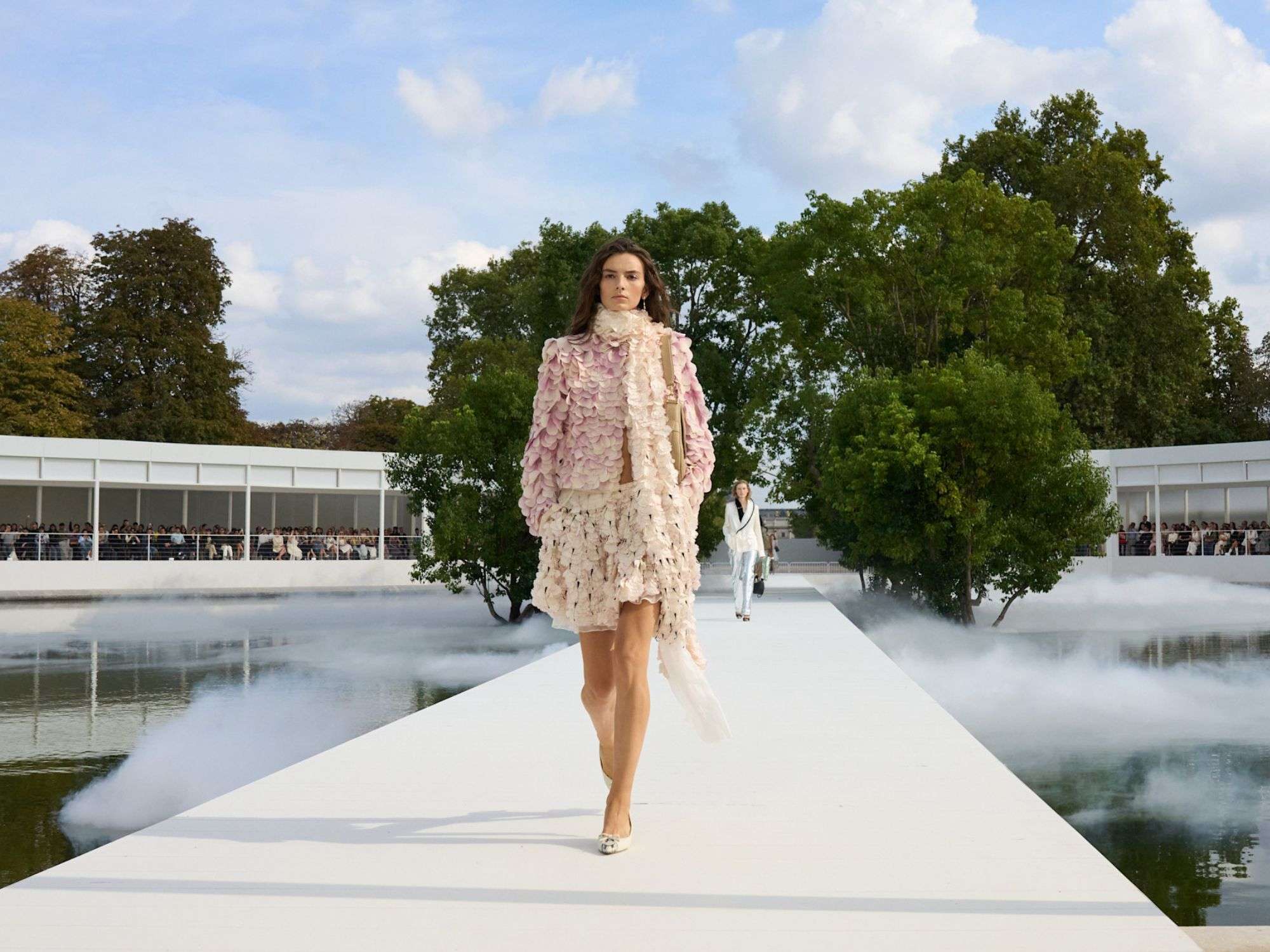 Dior Summer 2027 pink petal ensemble on the tree-lined runway